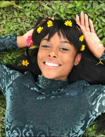 Example tribute photo — gentle candlelight (placeholder) for Kesha K. François