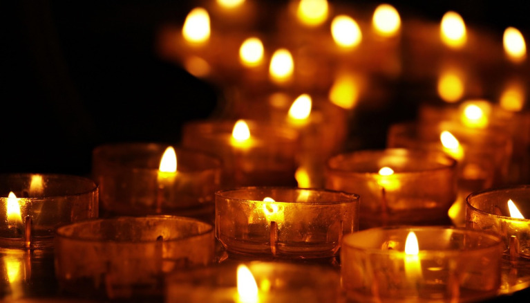 Example tribute photo — gentle candlelight (placeholder) for Derrick Tomlin Davis